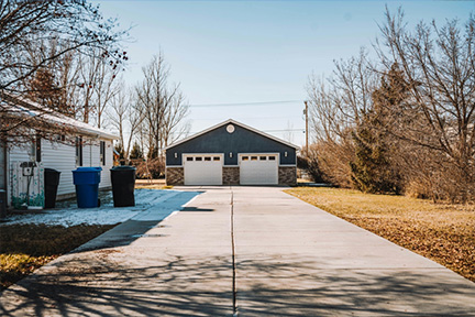 Detached two-car garage beside a mobile home