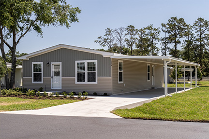 Front of a manufactured home with a carport